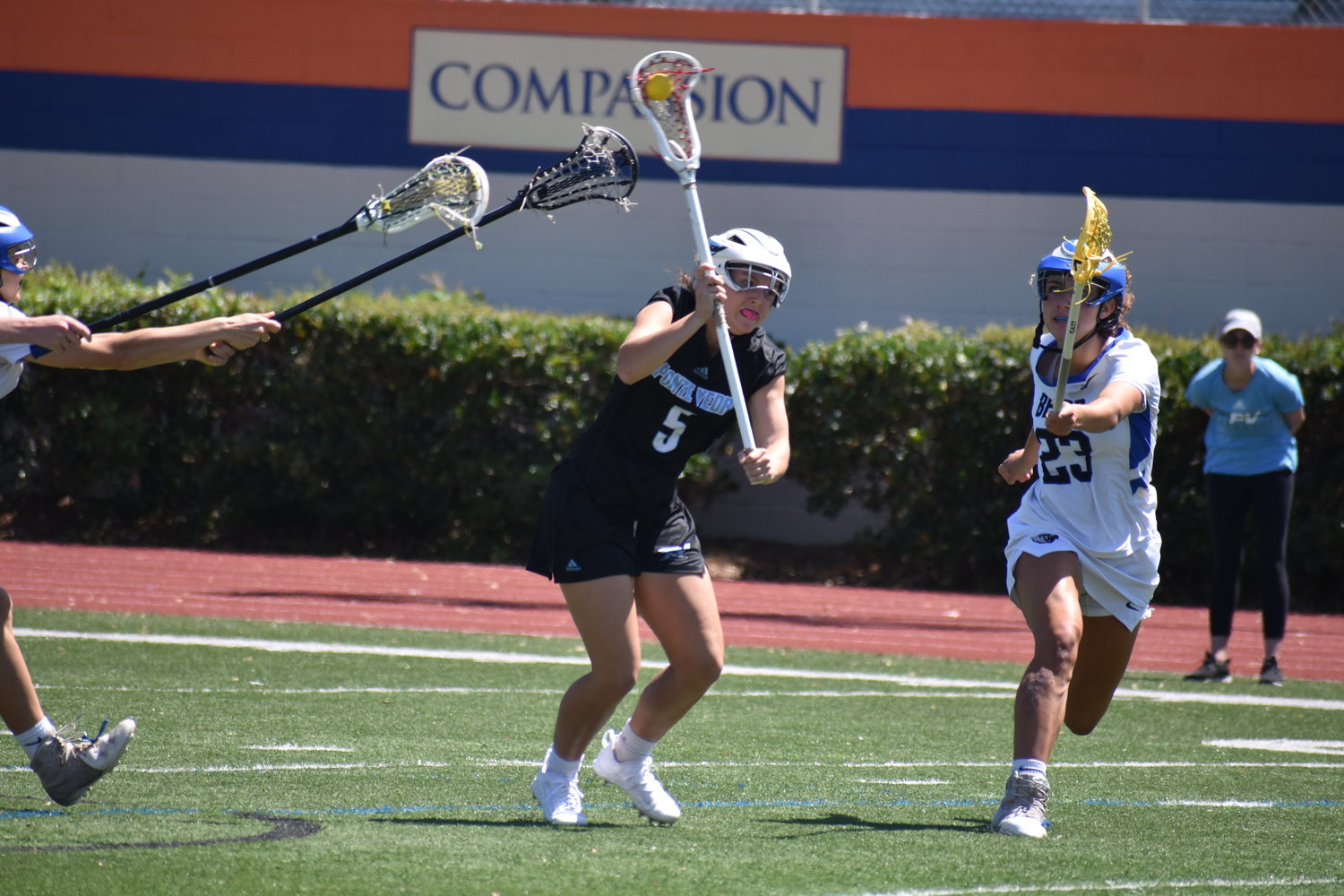 Lily Mosser fires a shot on goal between a trio of converging Bartram Trail defenders during the Second Annual Rivalry on the River Lacrosse Tournament hosted by The Bolles School March 26.